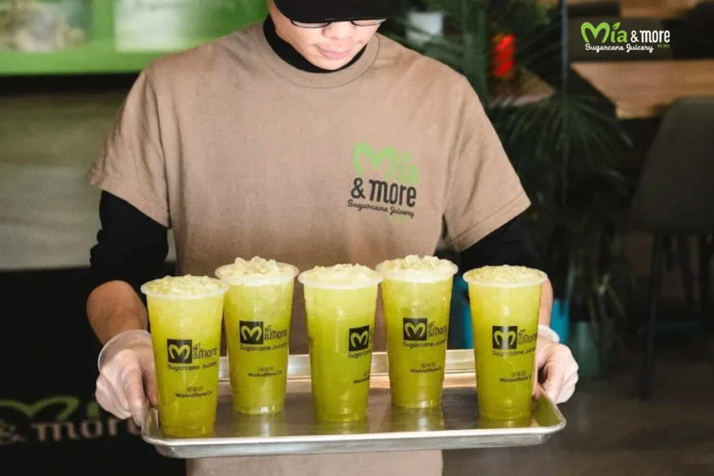 Fresh sugarcane juice being pressed-to-order at the counter Fresh sugarcane juice being pressed-to-order at the counter